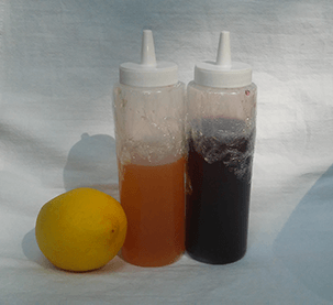Containers of Lemon and Pomegranate Sekanjabin
